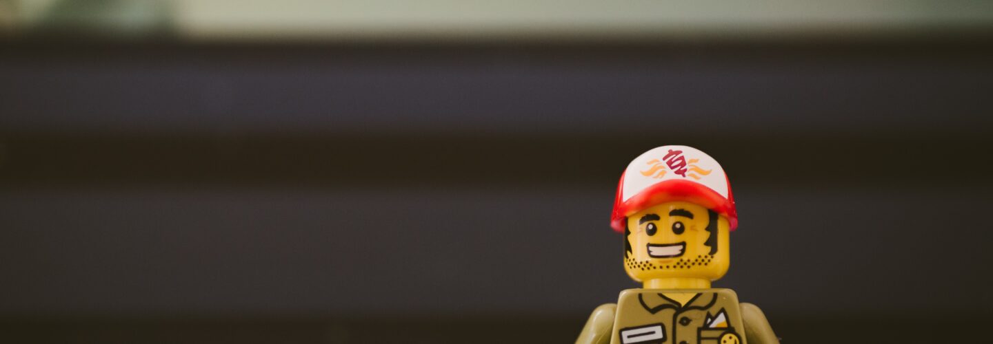 Lego figurine infront of computer